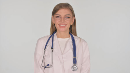 Portrait of Smiling Female Doctor on White Backgroundの写真素材