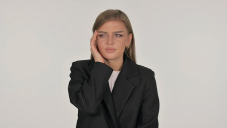 Portrait of Businesswoman with Migraine on White Backgroundの写真素材