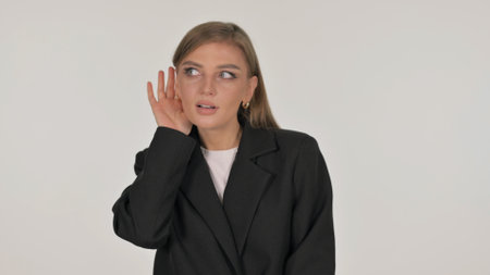 Portrait of Businesswoman Trying to Listen on white Backgroundの写真素材
