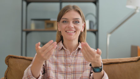 Portrait of Woman inviting Peopleの写真素材