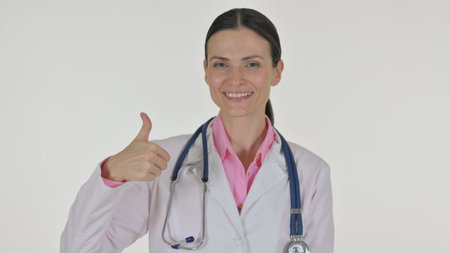 Portrait of Female Doctor with Thumbs Up on White Backgroundの写真素材