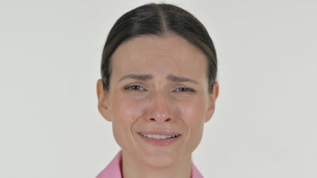 Close up of Crying Woman Face on white Backgroundの写真素材