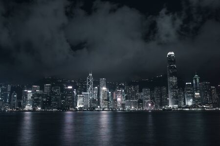 Buildings in Victoria harbor Hong Kong city at nightのeditorial素材