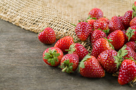 Strawberries on wooden table.の写真素材