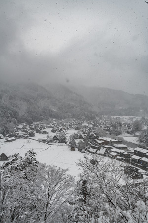 Top view of snowfall at village in winterの写真素材
