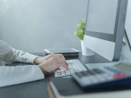 Businesswoman or accountant working on computer in office.の写真素材