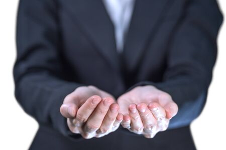 Business woman show empty plam hands isolated on white background, gesture for holding, giving, receive concept.の写真素材