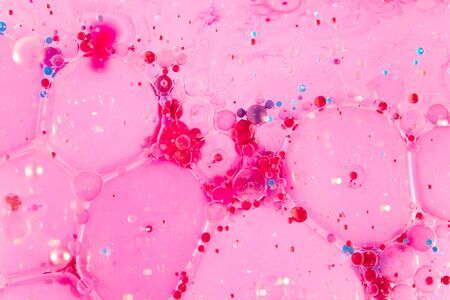 Abstract background with oil in water and color bubbles macro shot.