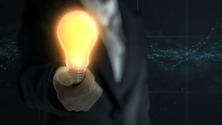 Business women holding glow light bulb for new ideas and innovative solutions concept.の写真素材