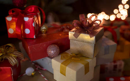 Christmas or New Year gift boxes on bokeh lights background