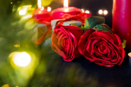 Romance flora rose and red candles.の写真素材