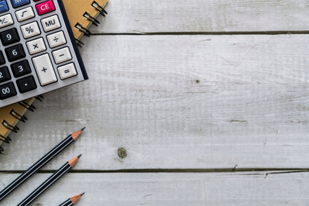 Top view business financial or education concept with notebook, calculator and pencilsの写真素材