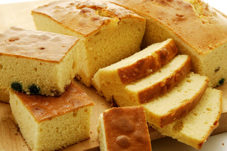 A closeup of a few cut cubes of homemade sponge cake