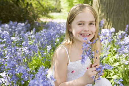 Young girl in bluebell woodの写真素材