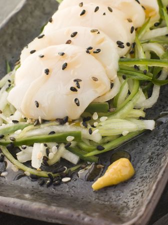 Sashimi of Dive Scallops Cucumber Mouli and sesame saladの写真素材