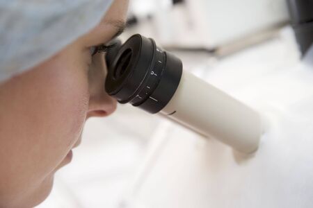 Embryologist adding sperm to eggの写真素材