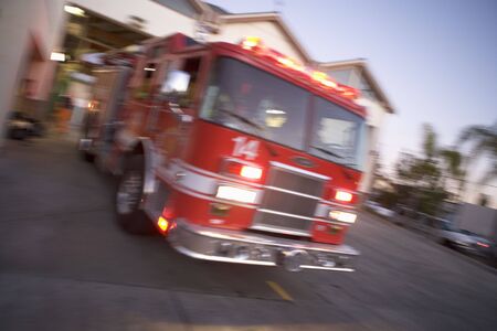 Fire engine leaving firehouse (blur)