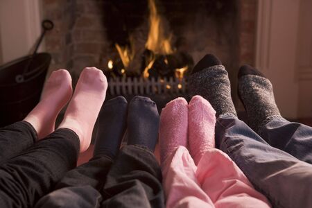  of Feet warming at a fireplaceの写真素材