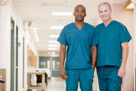 Two Orderlies Standing In A Hospital Corridorの写真素材
