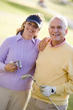 Couple Enjoying A Game Of Golfの写真素材