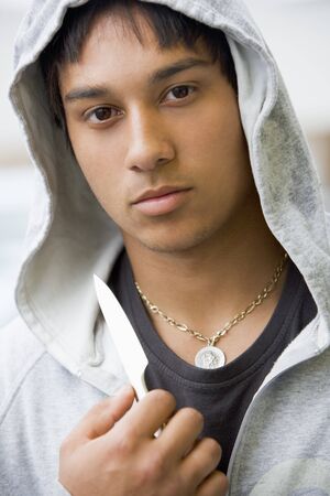 Teenage Boy Brandishing Knifeの写真素材