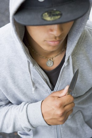 Teenage Boy Brandishing Knifeの写真素材