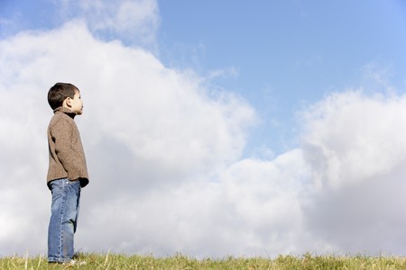 Young Boy Standing In The Parkの写真素材
