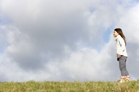 Young Girl Standing In The Parkの写真素材