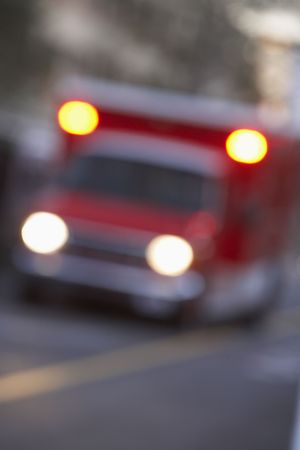 Defocused shot of ambulance on a city streetの写真素材