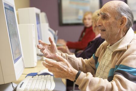 Senior man using computerの写真素材