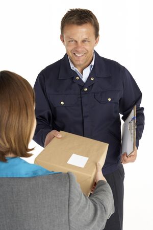 Courier Handing Over A Parcel To An Office Workerの写真素材