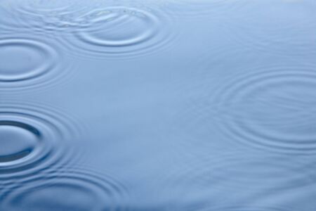 Concentric Circles Forming In Still Waterの写真素材