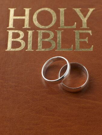 Wedding Rings Resting On A Holy Bibleの写真素材