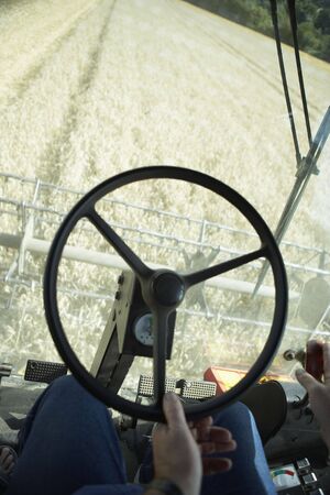 Combine Harvester Working In Fieldの写真素材