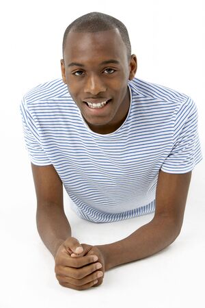 Teenage Boy Laying On Stomachの写真素材