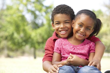 Portrait Of Brother And Sister In Parkの写真素材