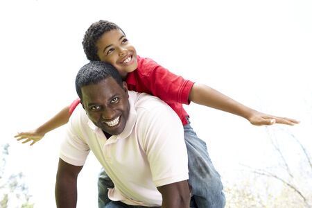 Portrait of Happy Father and Son In Parkの写真素材