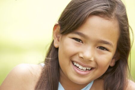 Portrait Of Young Girl In Park
