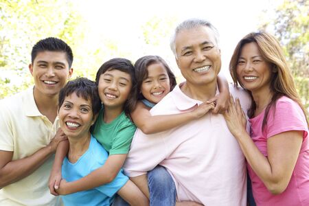 Portrait Of Extended Family Group In Parkの写真素材