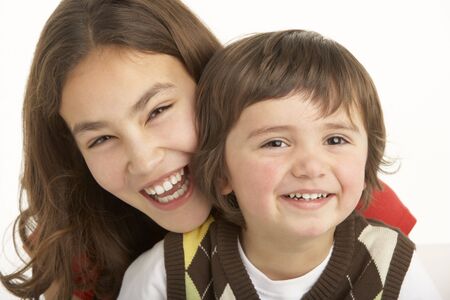 Studio Portrait Of Brother And Sister