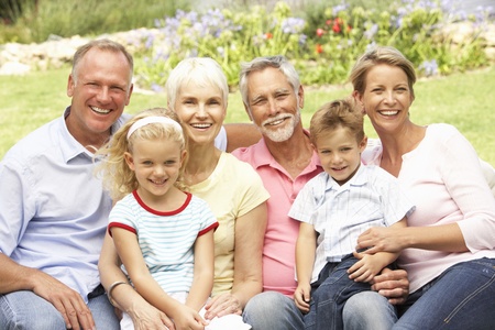 Extended Family Relaxing In Gardenの写真素材