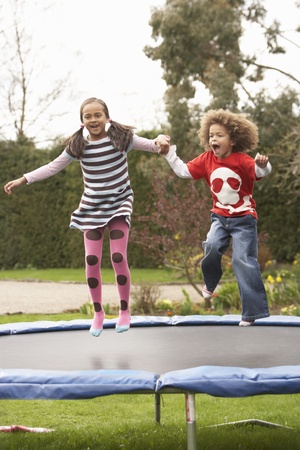 Children Playing On Trampolineの写真素材