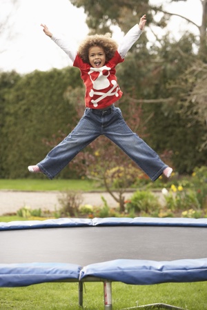 Boy Playing On Trampolineの写真素材