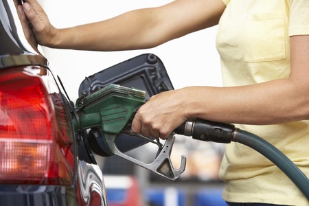 Detail Of Female Motorist Filling Car With Petrol At Petrol Stationの写真素材