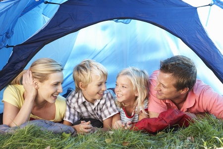 Young family poses in tentの写真素材