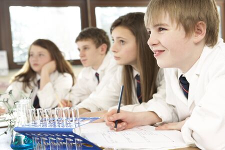 Group Of Teenage Students In Science Class