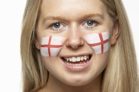 Young Female Sports Fan With St Georges Flag Painted On Faceの写真素材