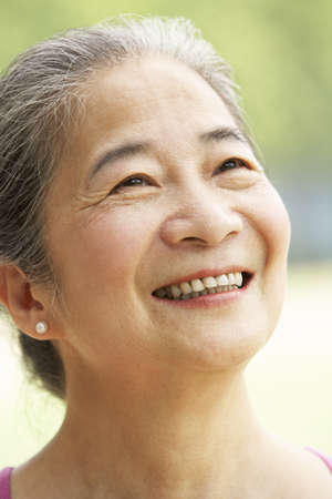 Head And Shoulders Portrait Of Attractive Chinese Senior Womanの写真素材