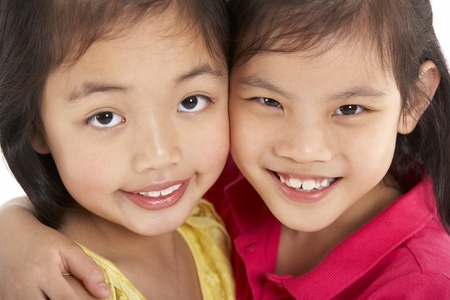 Studio Shot Of Two Chinese Girlsの写真素材