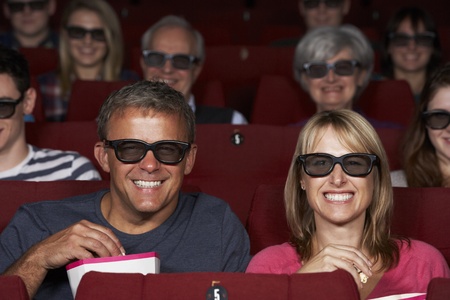 Couple Watching 3D Film In Cinema